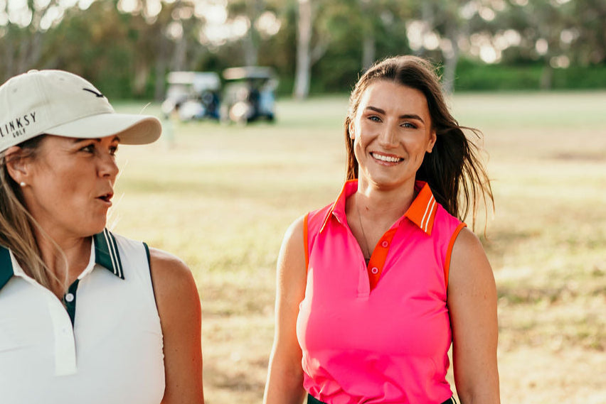 Two women on course wearing Linksy Golf