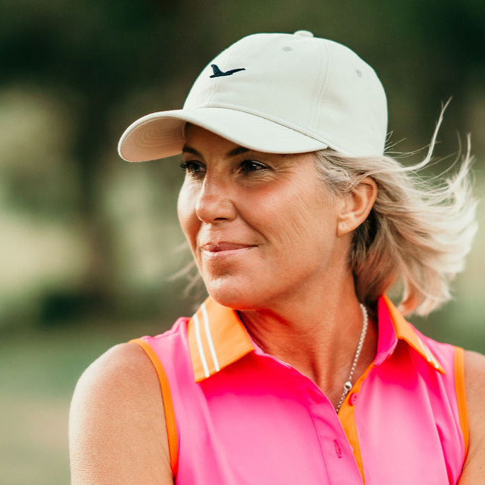Golfer wearing the Little Birdie golf cap, a breathable and lightweight hat designed for all-day comfort.