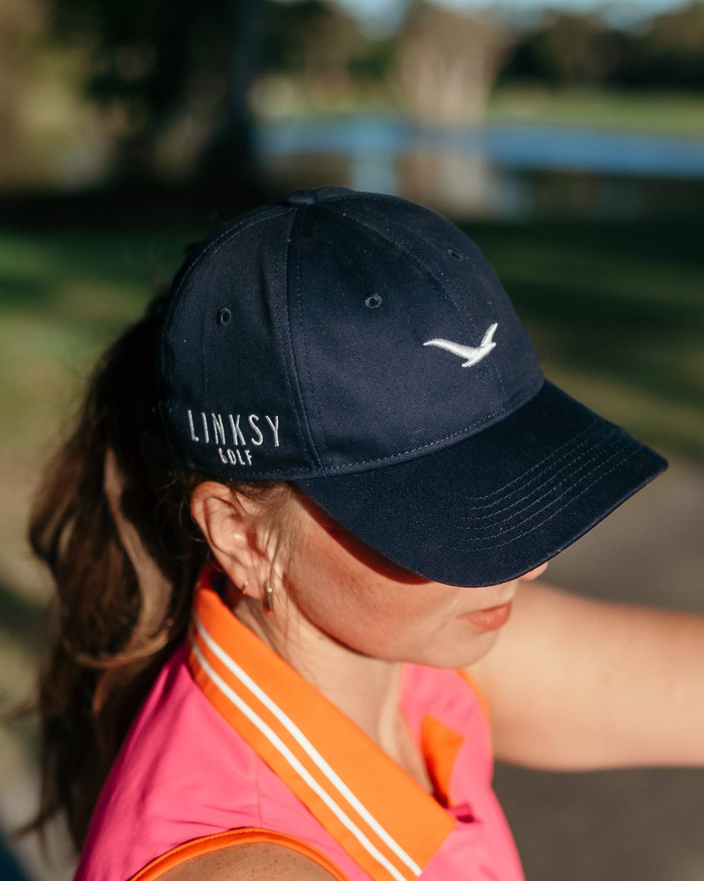 Girl Golfer wearing Linksy Golf Little Birdie Cap Navy On Course