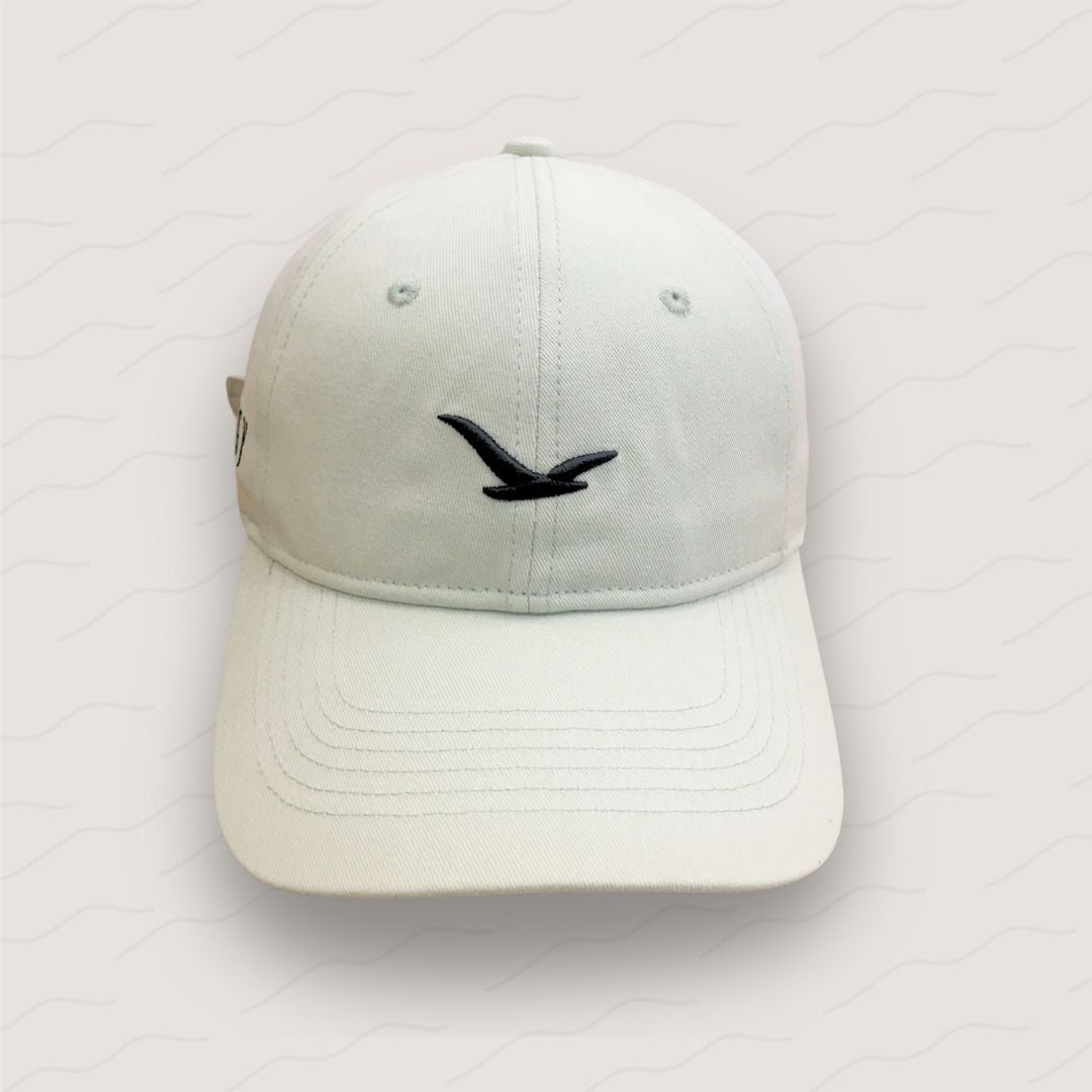 Little Birdie golf cap in a neutral shade, featuring a 3D embroidered bird logo and classic unstructured fit.