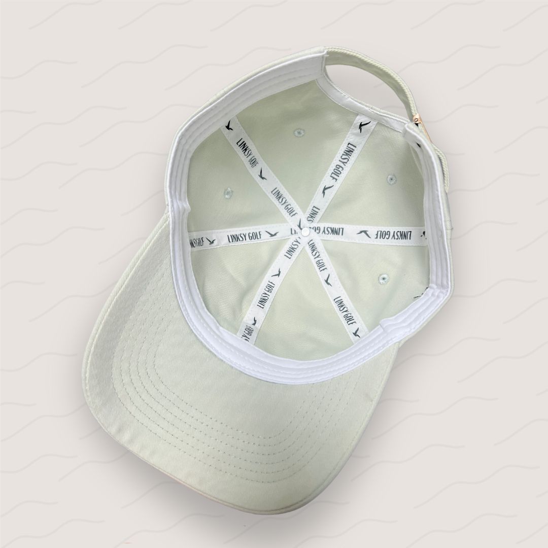 Inside view of the Little Birdie golf cap, highlighting its breathable lining and structured stitching for durability
