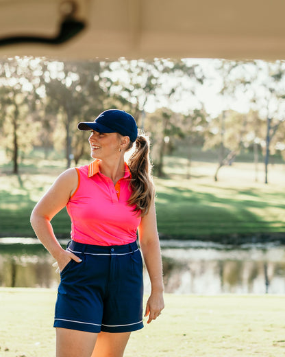stella shorts navy worn by a golf girl on the golf course