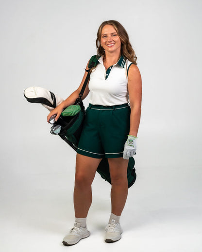 Margie Polo in white with Evergreen piping, a modern sleeveless golf polo designed for movement, breathability, and all-day wear.